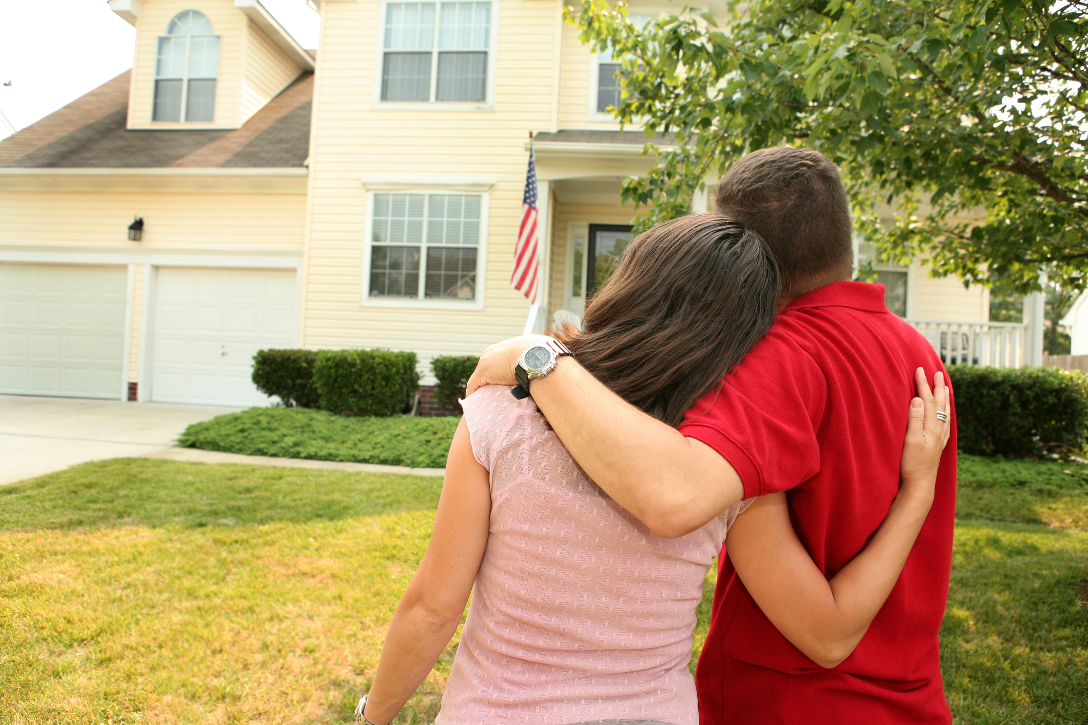 Couple looking at their home
